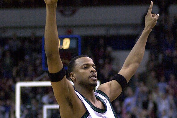 Minnesota Timberwolves' Todd Day (11) celebrates their 99-96 win over the Milwaukee Bucks, Monday, Jan. 29, 2001, in Minneapolis. (AP Photo/Tom Olmscheid)