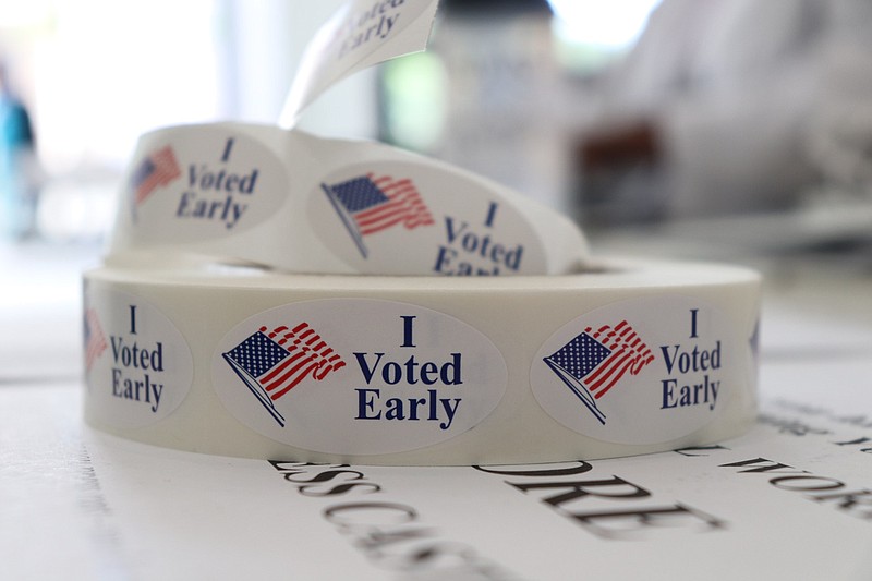 A roll of stickers awaiting distribution to early voters sits on a table at the check-in station at the Pulaski County Courthouse Annex in Little Rock.
