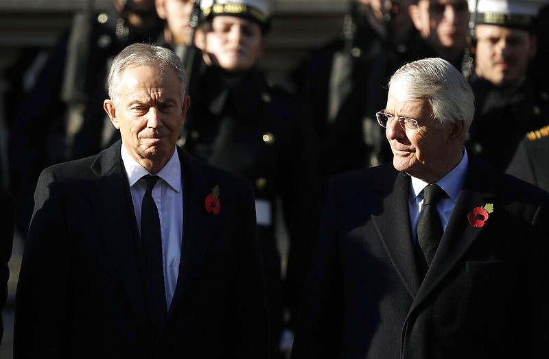 Former British Prime Ministers Tony Blair (left) and John Major attend the Remembrance Sunday ceremony at the Cenotaph in Whitehall in London in this Sunday, Nov. 10, 2019 file photo, Remembrance Sunday is held each year in honor of those who fought in past military conflicts. Blair and Major on Sunday, Sept. 13, 2020, joined forces to urge lawmakers to reject government plans to override the Brexit deal with the European Union. story.lead_photo.caption