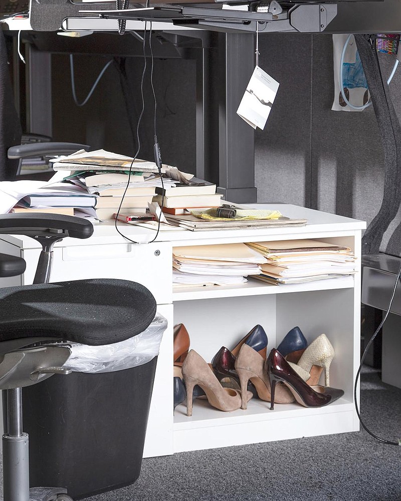 Heels are stored at a desk in New York in July. In the same way that smartphones have made it possible to work at all places and all times, just because you can wear your stretchy old workout gear in front of the computer, doesn’t always make it a good idea.
(The New York Times/Chris Maggio)