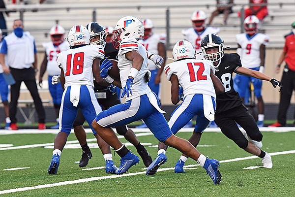 Parkview running back Willie Eackles runs 94 yards to score the first touchdown of a game against White Hall on Thursday, Sept. 11, 2020, in White Hall.