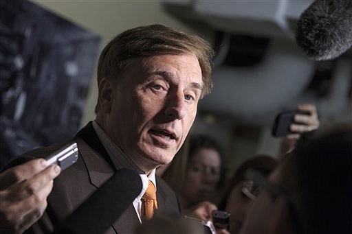 FILE - In this July 25, 2014 file photo, then-Rep. John Fleming, R-La., speaks to reporters on Capitol Hill in Washington. Fleming now works in the White House, including on the Coronavirus Task Force. story.lead_photo.caption