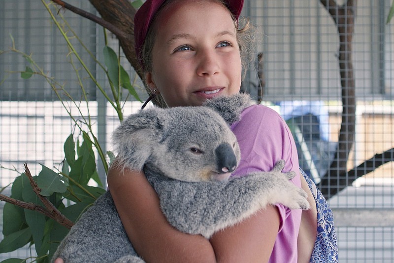 Izzy Bee, 11, helps her veterinarian mom take care of ailing or orphaned koalas on Magnetic Island, off the coast of Australia, in the new Netflix series “Izzy’s Koala World.”
(Netflix via AP)