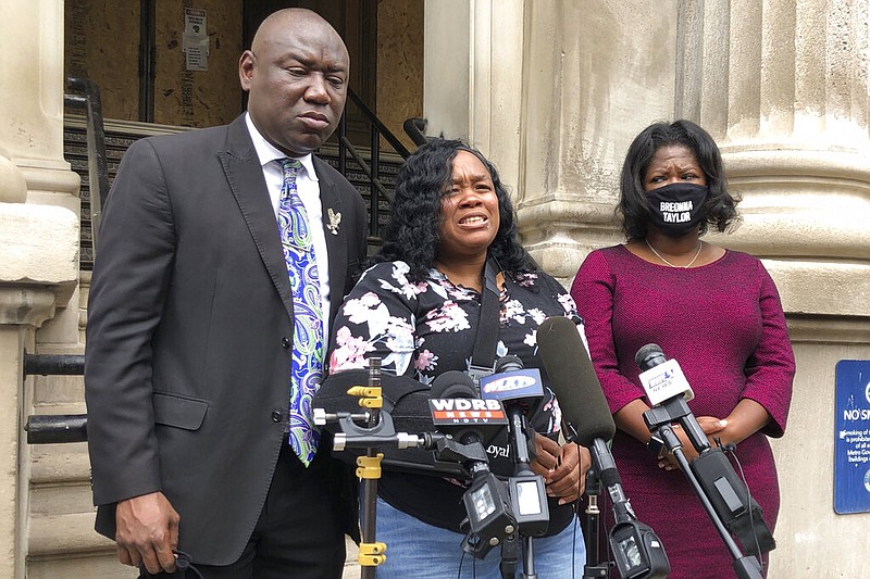 FILE - Tamika Palmer, mother of Breonna Taylor, addresses the media in Louisville, Ky., on Thursday, Aug. 13, 2020. The city of Louisville will pay several million dollars to the mother of Breonna Taylor and install police reforms as part of a settlement of a lawsuit from Taylor’s family, The Associated Press has learned. (AP Photo/Dylan Lovan, FIle)

