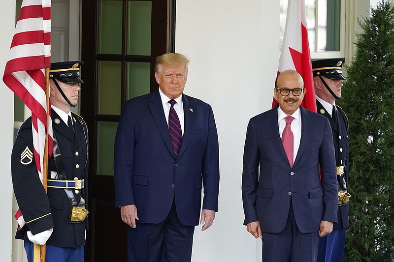 President Donald Trump greets the Bahrain Foreign Minister Khalid bin Ahmed Al Khalifa at the White House, Tuesday, Sept. 15, 2020, in Washington. (AP Photo/Alex Brandon)


