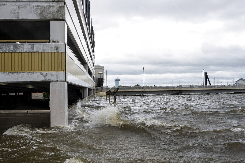 Storm surge from Hurricane Sally overtakes the outside parking lot and the first floor of the Palace casino parking garage in Biloxi, Miss., on Tuesday, Sept. 15, 2020. The slow moving hurricane is driving a developing tidal surge and rains to a number of communities along the gulf coast. (Lukas Flippo/The Sun Herald via AP) story.lead_photo.caption