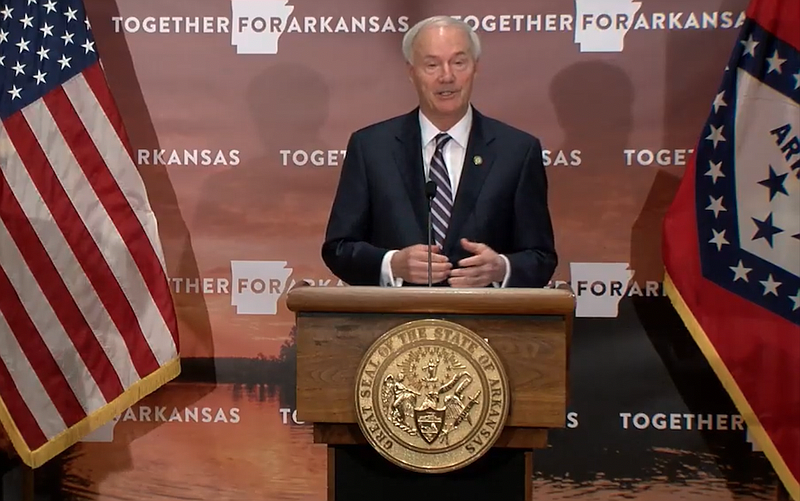 Arkansas Gov. Asa Hutchinson speaks to reporters at the state Capitol in Little Rock on Tuesday in this still of video provided by the governor's office. 