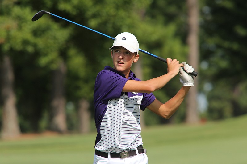 Fayetteville High School golfer Connor Goens watches his tee shot on the sixth hole Monday, September 14, 2020, during the Fayetteville High School Bulldog Open Golf Tournament at Fayetteville Country Club in Fayetteville. 
(NWA Democrat-Gazette/David Gottschalk)