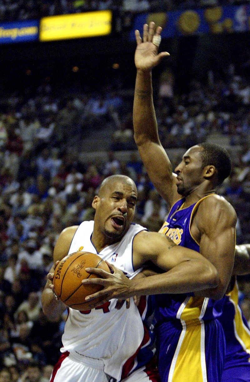 Corliss Williamson (left) of the Detroit Pistons tries to get around Kobe Bryant of the Los Angeles Lakers during Game 5 of the 2004 NBA Finals. Helping the Pistons win the NBA title was the highlight of a 12-year professional career for Williamson, a two-time All-American and SEC Player of the Year who led the University of Arkansas to the 1994 NCAA championship. 
(AP file photo) 