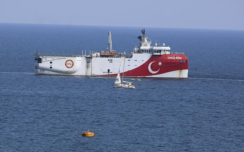 The Turkish research vessel Oruc Reis lies anchored off the coast of Antalya on Sunday where Greek Prime Minister Kyriakos Mit- sotakis welcomed the vessel’s return from a disputed area of the eastern Mediterranean.
(AP/Burhan Ozbilici)
story.lead_photo.caption