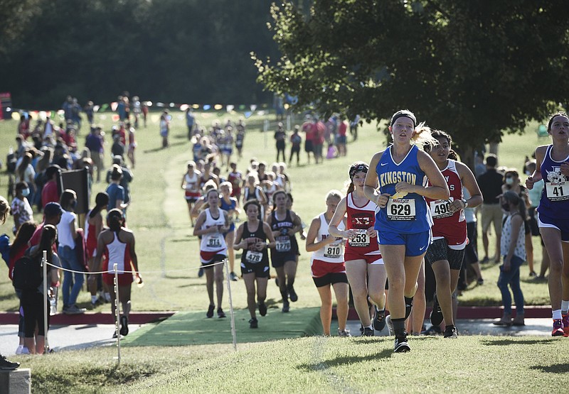 FILE -- Student athletes run a course, September 5, 2020 during the Saints Invitational cross country meet at Shiloh Christian High School in Springdale. (NWA Democrat-Gazette/Charlie Kaijo)