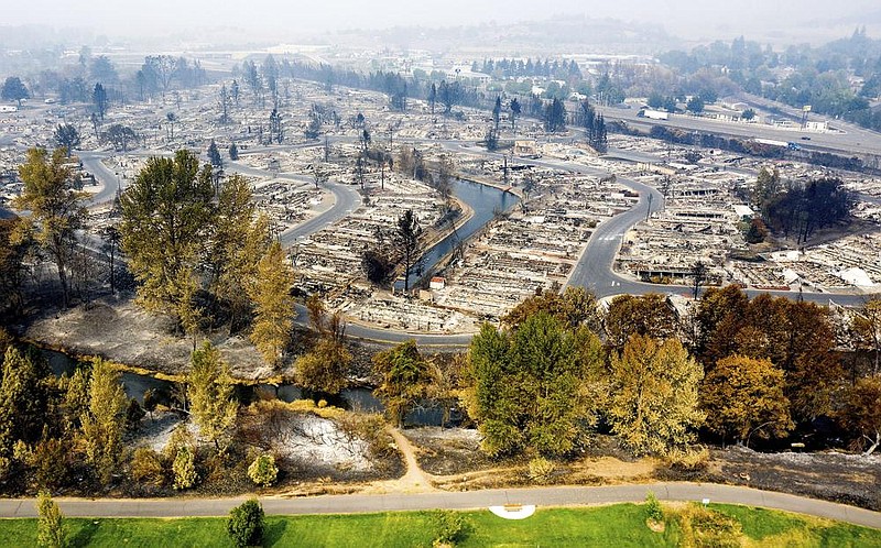 This drone image taken Tuesday shows homes leveled by wildfire at Bear Lake Estates in Phoenix, Ore. The entire state is under a smoke advisory through Thursday. More photos at arkansasonline.com/916smoke/. (AP/Noah Berger) 