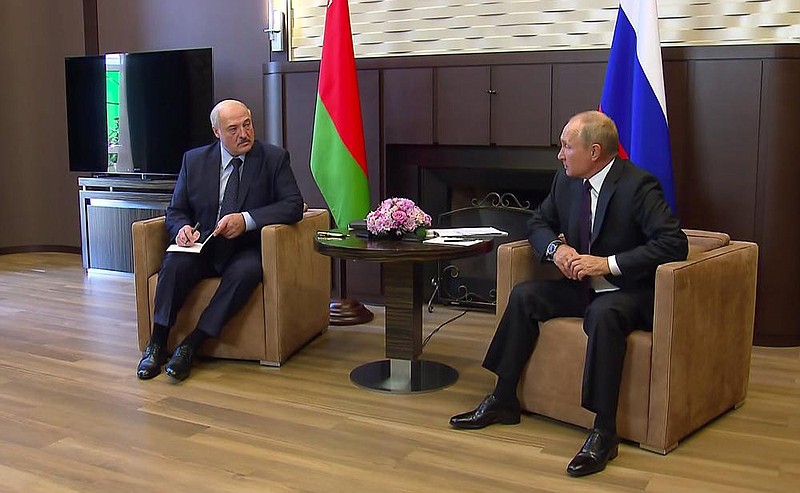 Belarusian President Alexander Lukashenko (left) meets Monday with Russian counterpart Vladimir Putin during a visit to Sochi, Russia. (AP/Russian Presidential Press Service) 