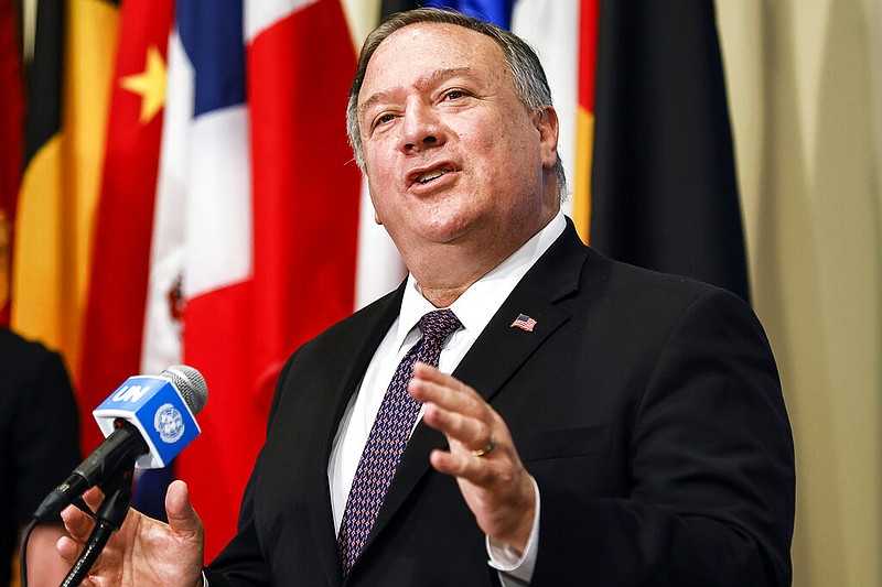 In this Thursday, Aug. 20, 2020 file photo, Secretary of State Mike Pompeo speaks to reporters after a meeting with members of the U.N. Security Council, at the United Nations. The United States is preparing to declare that all international sanctions against Iran have been restored, despite overwhelming opposition. Few countries believe restoring all international sanctions is legal, and the U.S. move could provoke a credibility crisis at the United Nations. (Mike Segar/Pool via AP, File)