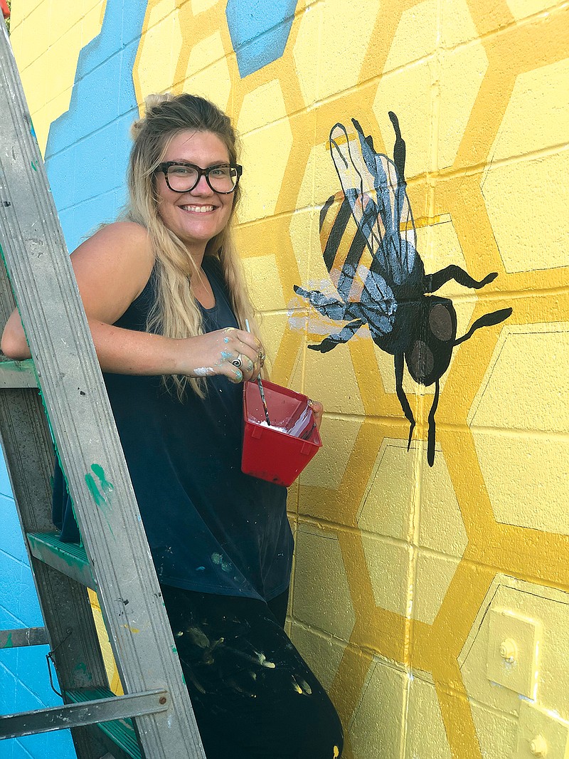 Sarah Wells, a local artist from Cabot, recently painted her first large outside mural titled “Holy Cow,” at 119 N. Adams St. The mural is part of the Cabot Foundation for Arts and Culture.