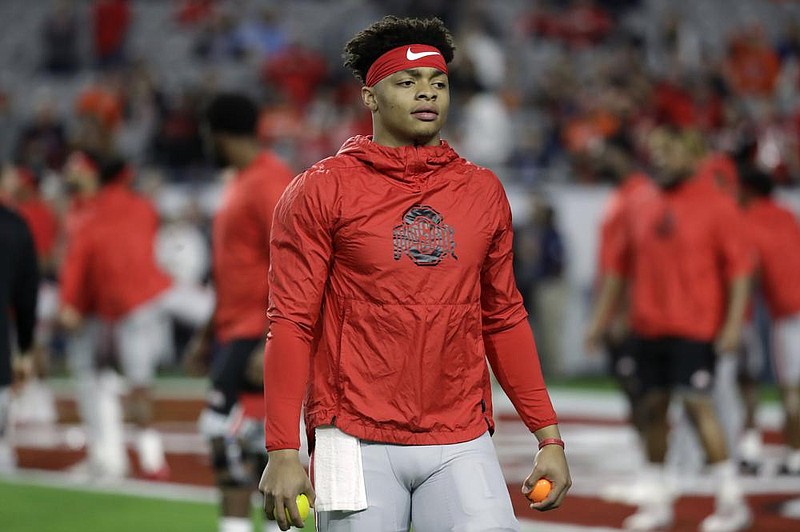 Ohio State quarterback Justin Fields (1) during the first half of the Fiesta Bowl NCAA college football game against Clemson, Saturday, Dec. 28, 2019, in Glendale, Ariz. 
(AP Photo/Rick Scuteri)