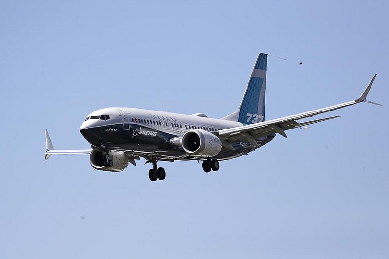 A Boeing 737 Max jet heads to a landing at Boeing Field in Seattle after a test flight in June.
(AP)