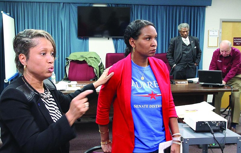 Keidra Burrell (center), a Democratic candidate for the District 27 Senate seat, listens as her friend Shandra Griffin talks after a meeting of the Jefferson County Election Commission earlier this year, with Commissioner Ted Davis in the background. 
(Arkansas Democrat-Gazette file photo/Dale Ellis)