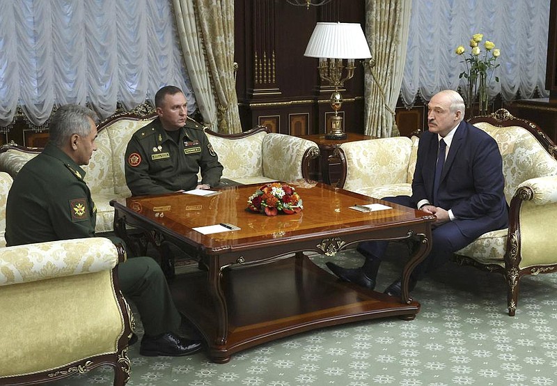 Russian Defense Minister Sergei Shoigu (from left) meets with Belarusian Defense Minister Viktor Khrenin and President Alexander Lukashenko on Wednesday in Minsk, Belarus.
(AP/BelTA Pool/Maxim Guchek)