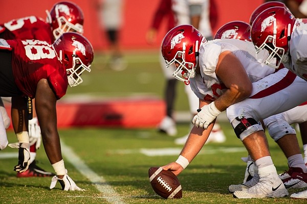 Arkansas football players line up before a play during a preseason practice on Sept. 15, 2020 in Fayetteville.