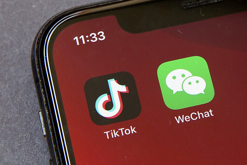 FILE - Icons for the smartphone apps TikTok and WeChat are seen on a smartphone screen in Beijing, in a Friday, Aug. 7, 2020 file photo.