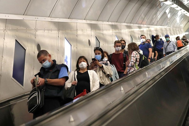 People take the escalator Thursday in the subway in Prague, Czech Republic. As cases soar in a second wave of the coronavirus, officials have further tightened already restrictive measures.
(AP/Petr David Josek) story.lead_photo.caption