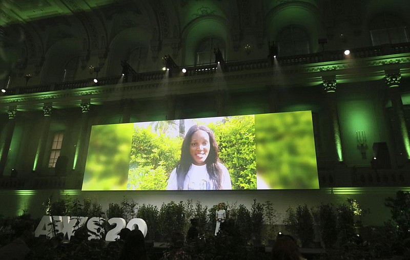 Climate activist Vanessa Nakate, on a giant screen Thursday at the Austrian World Summit in Vienna, calls for preserving the Congo rain forest.
(AP/Ronald Zak)