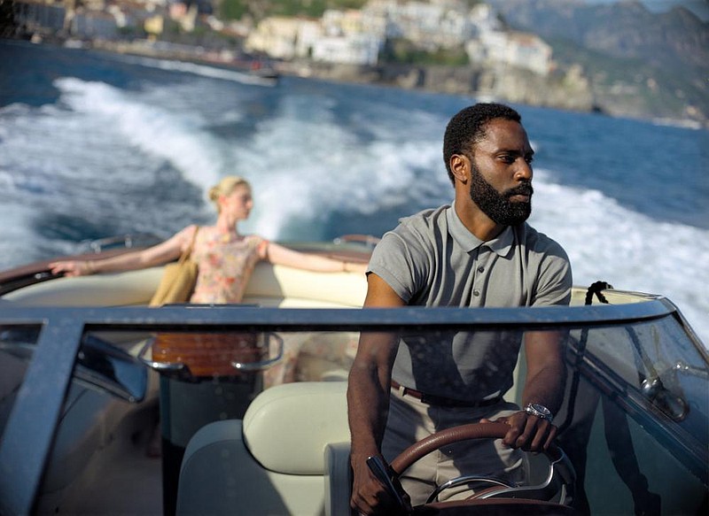 Elizabeth Debicki and John David Washington go for a ride in Christopher Nolan’s “Tenet,” which some have proclaimed an intellectual spectacle and others have found baffling.