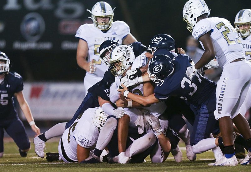 Greenwood defenders smother Choctaw quarterback Steele Wasel (center) on Friday at Greenwood High School. The Bulldogs won 23-12. More photos at arkansasonline.com/919greenwood/
(NWA Democrat-Gazette/Charlie Kaijo)