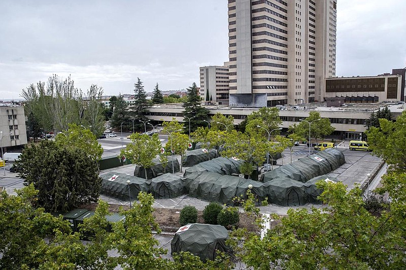 Spanish military tents sit ready Friday at the Gomez Ulla military hospital in Madrid four months after similar structures for an overflow of coronavirus patients were taken down. More photos at arkansasonline.com/919madrid/.
(AP/Manu Fernandez)