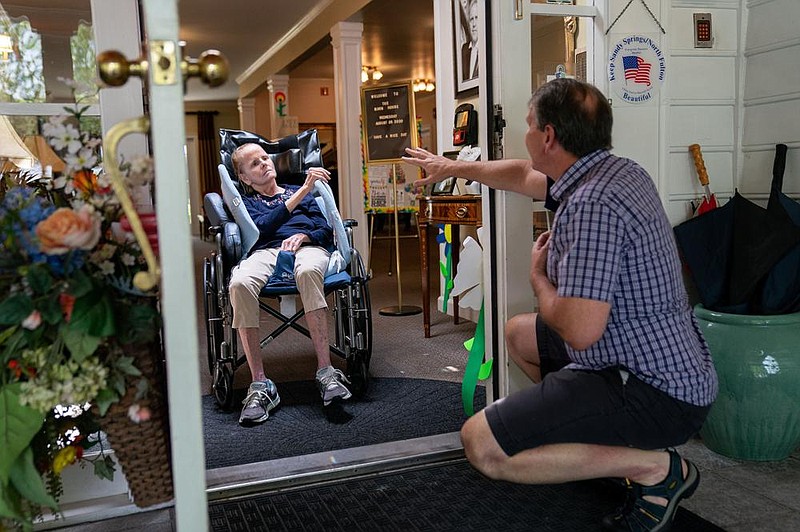 Dan Goerke, 61, visits his 63-year-old wife, Denise, at her assisted-living facility in the Sandy Springs suburb of Atlanta in early August. “Every day it gets a little worse,” he said, frustrated by her isolation. “We’ve lost months, maybe years, of her already.” (Photo for The Washington Post/Kevin D. Liles) 