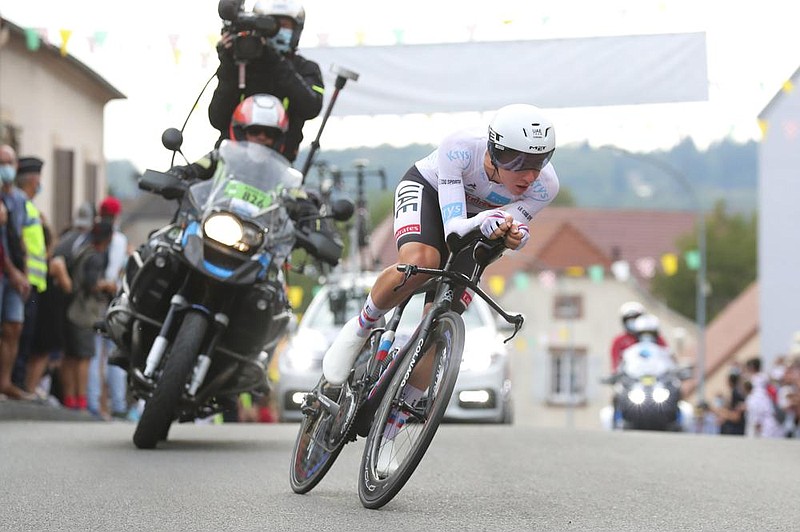 Tadej Pogacar of Slovenia has the lead going into today’s nal stage of the Tour de France. (AP Photo/Thibault Camus) 