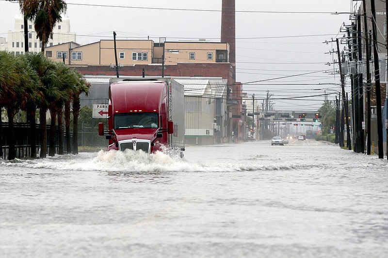 A truck drives through a flooded street in Galveston, Texas on Monday, Sept. 21, 2020. Parts of Texas and Louisiana braced for more flooding and damaging storm surge as Tropical Storm Beta slowly worked its way into a part of the country that’s already been drenched and battered during this year’s exceptionally busy hurricane season. (Jennifer Reynolds/The Galveston County Daily News via AP)
story.lead_photo.caption