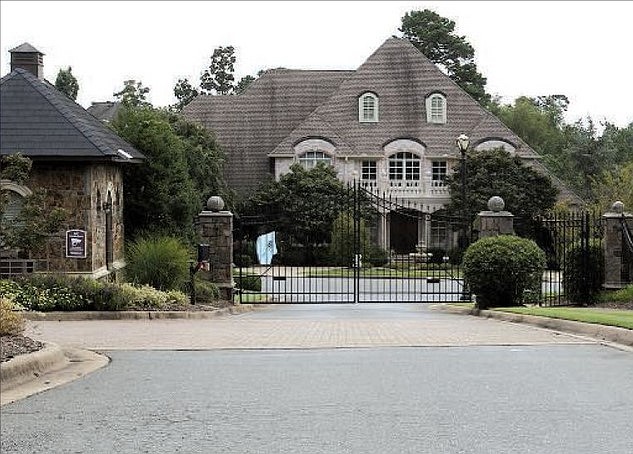 40 Germay Court -- Owned by Paula T. and Steven L. Bell, a house behind this gate was sold to Joann M. and Jeffrey J. Hall for $880,000.