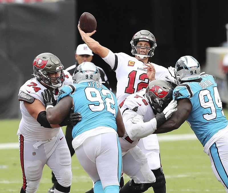 Tampa Bay Buccaneers quarterback Tom Brady (12) throws a pass against the Carolina Panthers during the second half of an NFL football game Sunday, Sept. 20, 2020, in Tampa, Fla. (AP Photo/Mark LoMoglio)