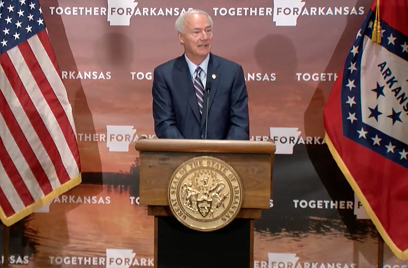 Arkansas Gov. Asa Hutchinson speaks to reporters at the state Capitol in Little Rock on Tuesday in this still of video provided by the governor's office. 
