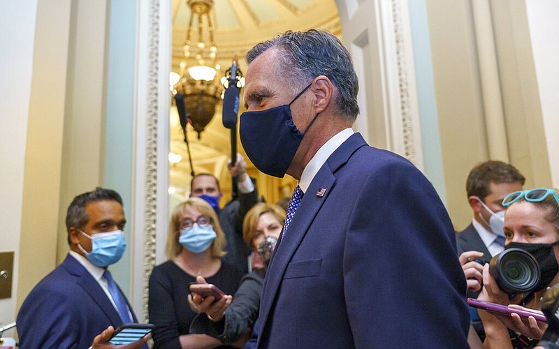 Sen. Mitt Romney, R-Utah, leaves the Senate Chamber following a vote, at the Capitol in Washington, Monday, Sept. 21, 2020.