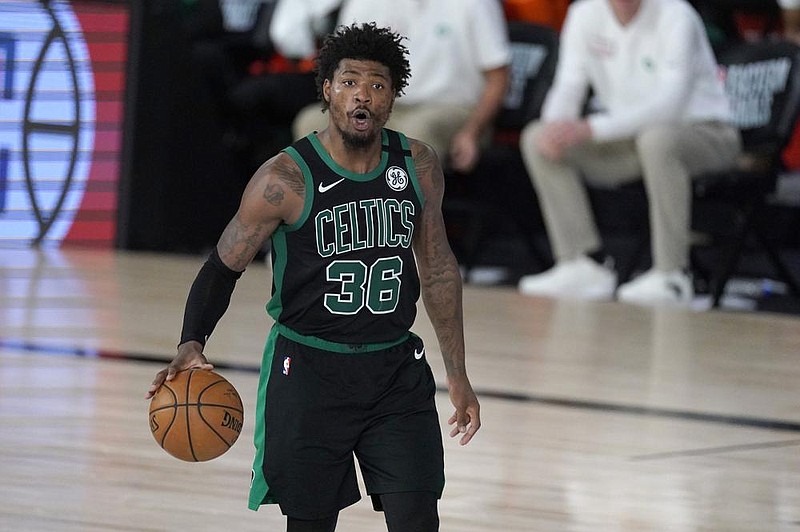 Boston Celtics' Marcus Smart (36) instructs the offense during the second half of an NBA conference final playoff basketball game against the Miami Heat on Tuesday, Sept. 15, 2020, in Lake Buena Vista, Fla. (AP Photo/Mark J. Terrill)