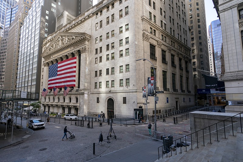 A giant American Flag hangs on the New York Stock Exchange, Monday, Sept. 21, 2020. U.S. stock indexes are mixed in early trading Wednesday, as Wall Street’s tumultuous month continues to churn. (AP Photo/Mary Altaffer)