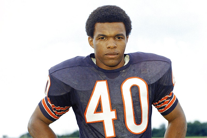 FILE - This is a 1970 file photo showing Chicago Bears football player Gale Sayers. Hall of Famer Gale Sayers, who made his mark as one of the NFL’s best all-purpose running backs and was later celebrated for his enduring friendship with a Chicago Bears teammate with cancer, has died. He was 77. Nicknamed “The Kansas Comet” and considered among the best open-field runners the game has ever seen, Sayers died Wednesday, Sept. 23, 2020, according to the Pro Football Hall of Fame. (AP Photo/FIle)