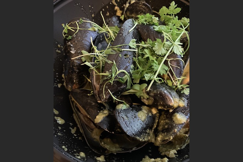 Coconut Ginger Mussels, one of the "share" plates at Petit & Keet, are steamed in green curry, fresh ginger and “aromatics.”
(Arkansas Democrat-Gazette/Eric E. Harrison) 