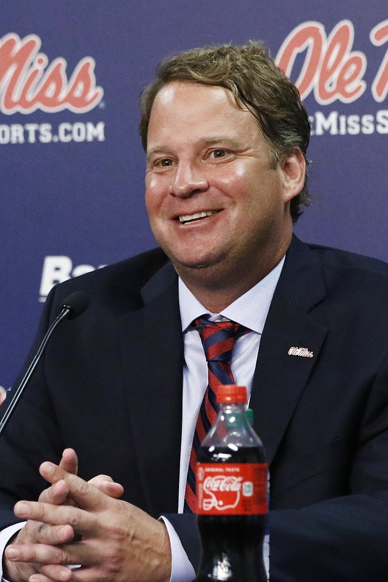 Lane Kiffin smiles at a reporter's question at a news conference, after being introduced to Mississippi fans as their new football coach, at The Pavilion, a multipurpose arena on the campus in Oxford, Miss., Monday, Dec. 9, 2019. Kiffin was previously, the football coach for three years at Florida Atlantic. (AP Photo/Rogelio V. Solis)