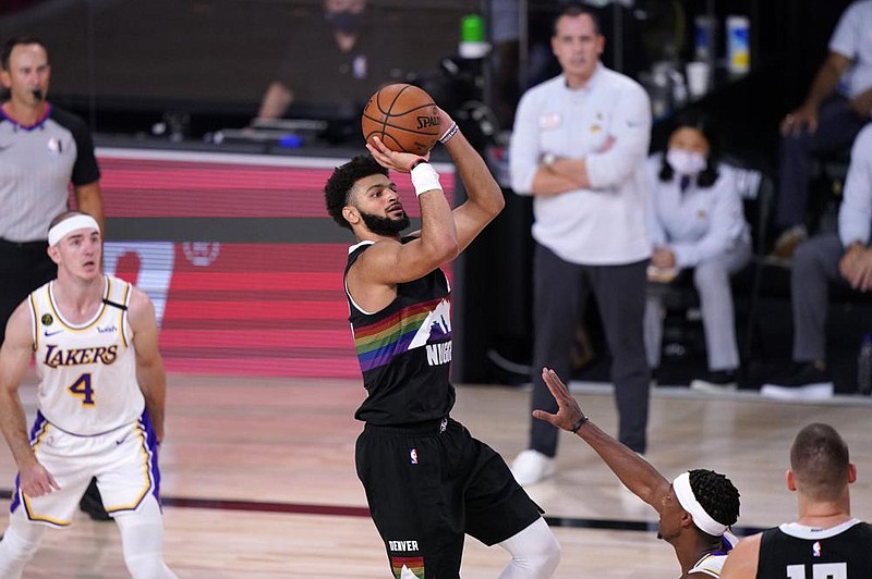 Jamal Murray of the Denver Nuggets scored 28 points, had 12 assists and 8 rebounds to lead the Nuggets to a 114-106 victory over the Los Angeles Lakers in Game 3 of the NBA’s Western Conference finals. 
(AP Photo/Mark J. Terrill) 