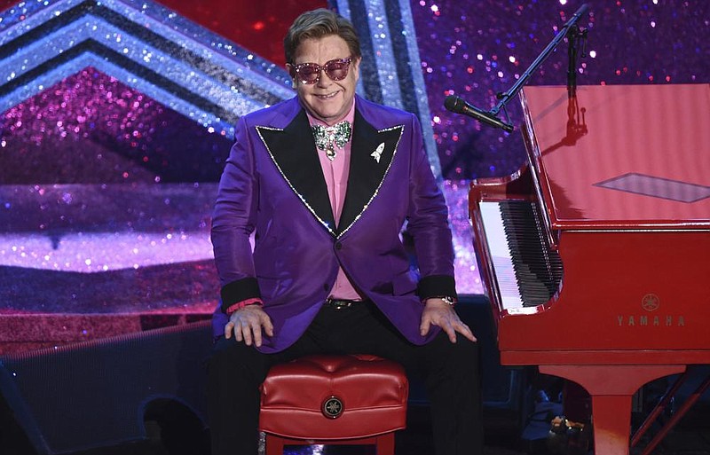 In this Sunday, Feb. 9, 2020, file photo, Elton John is seen after performing "(I'm Gonna) Love Me Again," nominated for the award for best original song from "Rocketman" at the Oscars at the Dolby Theatre in Los Angeles. 
 (AP Photo/Chris Pizzello, File)