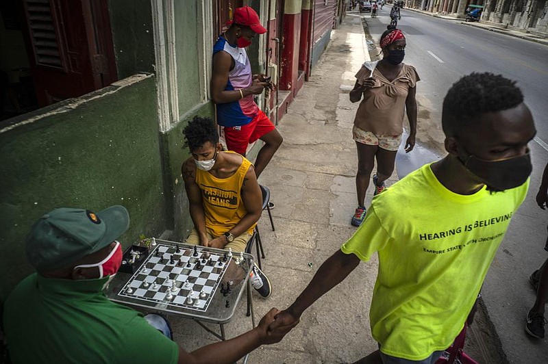 People play chess Wednesday on a sidewalk in Havana, Cuba. The Trump administration tightened sanctions against Cuba on Wednesday.
(AP/Ramon Espinosa)