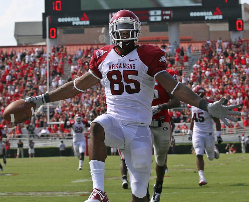 Arkansas wide receiver Greg Childs celebrates after scoring the winning touchdown in the final seconds on a pass from Ryan Mallett in the Razorbacks’ victory at Georgia in 2010. Georgia leads its series with Arkansas 10-4 entering Saturday’s game at Fayetteville.
(Democrat-Gazette file photo)