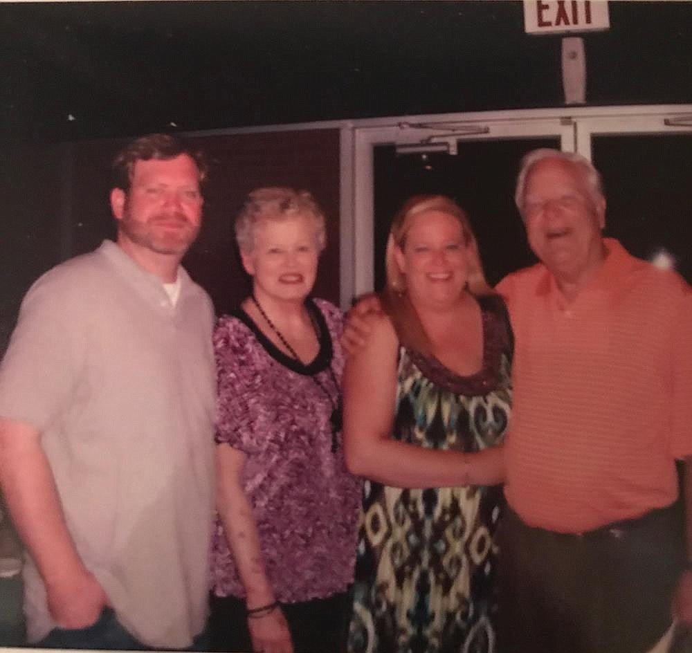 Robert Dill (right), who led the marketing department at Simmons Bank for many years, died Wednesday night. He is shown here with his son, Ryan; wife, MarJo, who died last year; and his daughter, Callie. (Special to The Commercial)