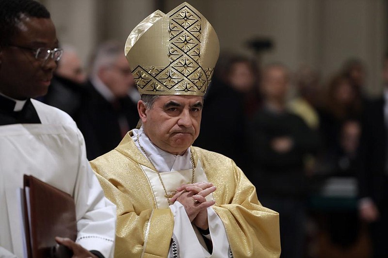  In this Feb. 9, 2017 file photo, Mons. Giovanni Angelo Becciu presides over an eucharistic liturgy, at the St. John in Latheran Basilica, in Rome. The powerful head of the Vatican's saint-making office, Cardinal Angelo Becciu, has resigned from the post and renounced his rights as a cardinal amid a financial scandal that has reportedly implicated him indirectly. (AP Photo/Gregorio Borgia, File)