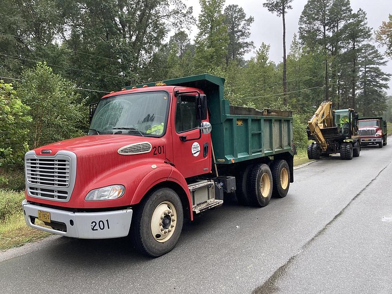 A Pine Bluff Street Department crew arrives Wednesday on Nevins Road to check a bridge for debris after recent rain. Superintendent Rick Rhoden said that his maintenance budget will suffer enormously if Issue 1 fails in November. 
(Pine Bluff Commercial/Byron Tate)