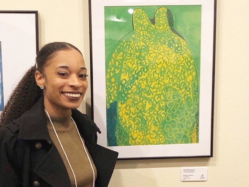 Kimiara Johnson shows off her artwork, "Nola Reception Couture Gown," at a gallery in this undated courtesy photo.
